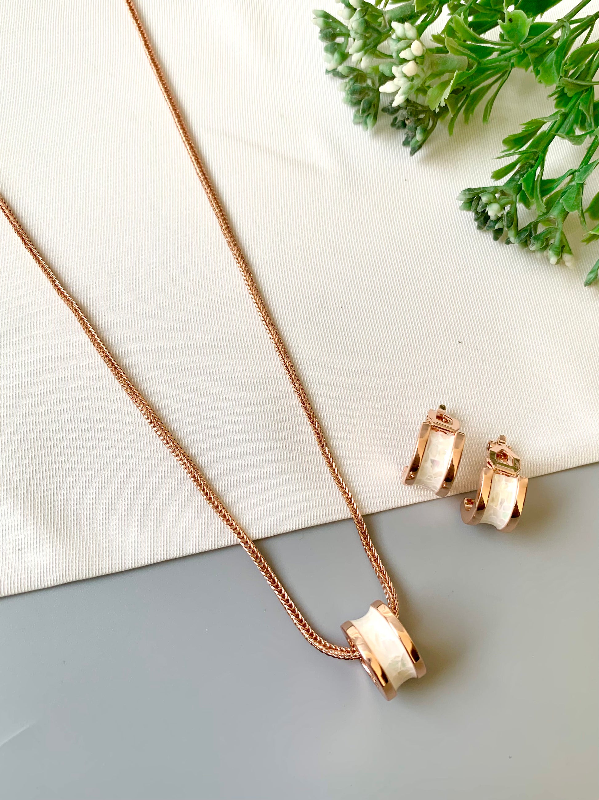 Handcrafted Noira Pendant Set in 22kt rose gold plating with real Mother of Pearl — by Zamal Jewels.