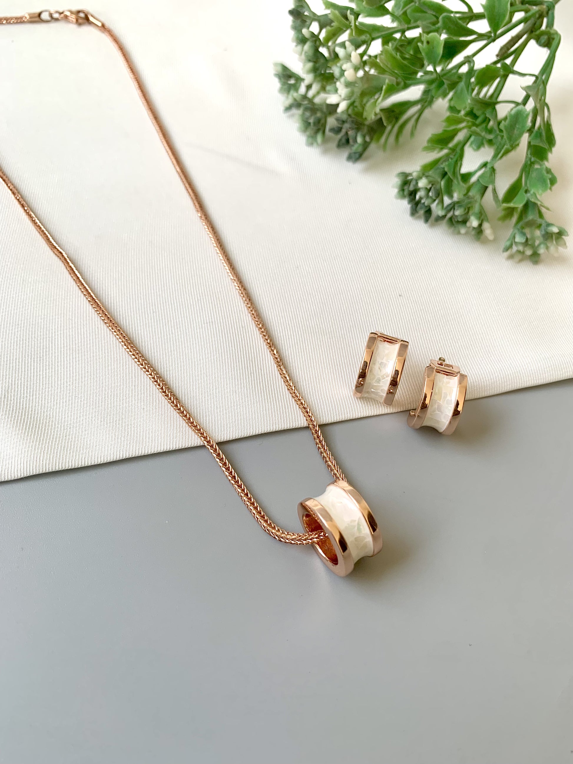 Handcrafted Noira Pendant Set in 22kt rose gold plating with real Mother of Pearl — by Zamal Jewels.