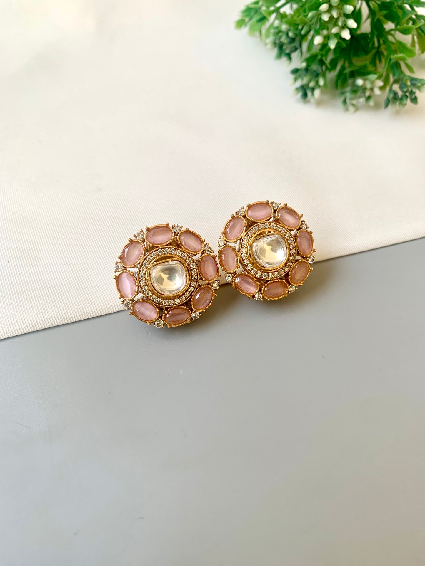 Hand crafted 22kt gold plated studs with American diamonds, moissanite kundan and semi-precious onyx by Zamal