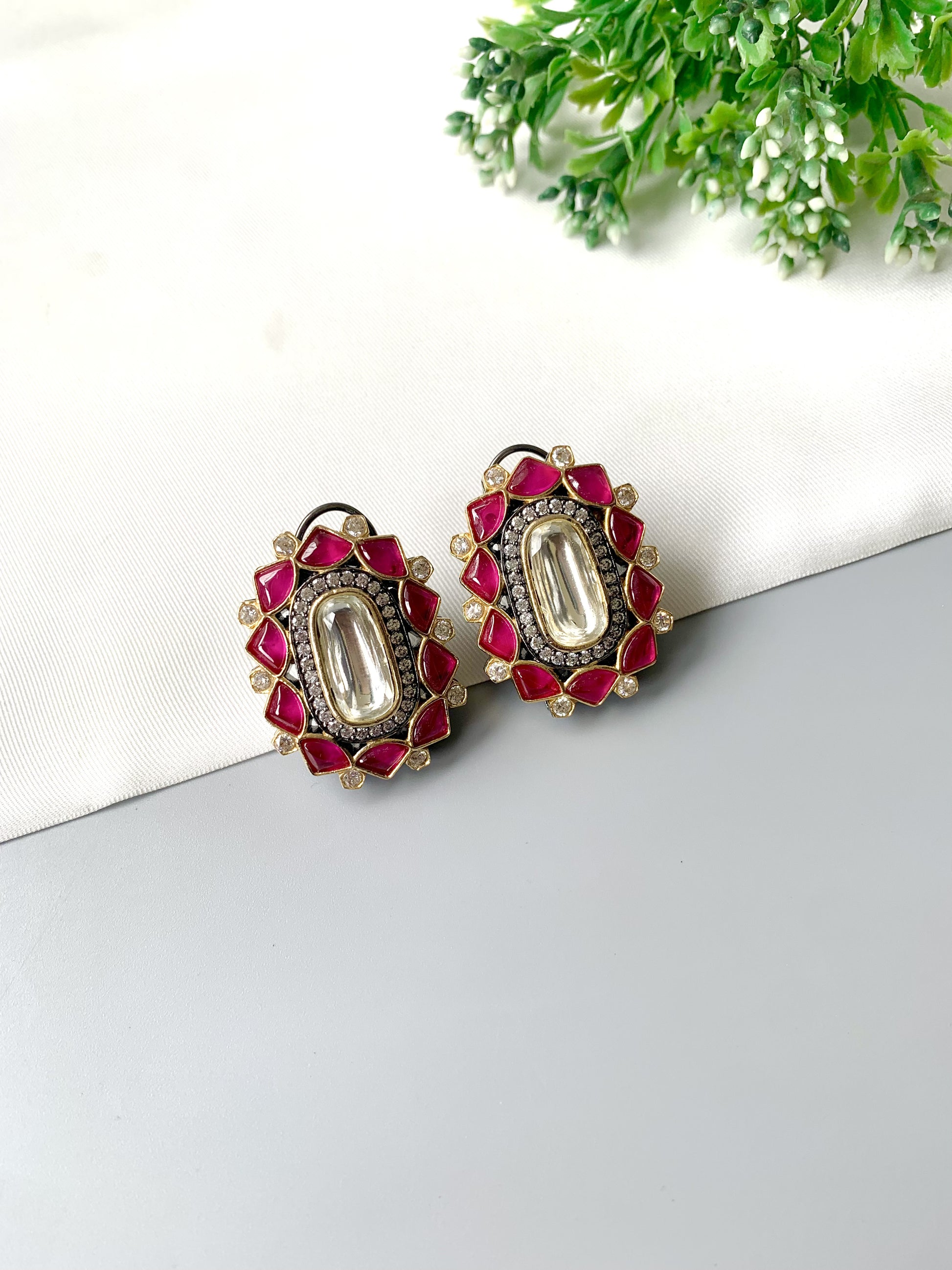Handcrafted Ravira Ruby Studs in oxidized rhodium plating with Polki Kundan centerpiece, ruby petals, and American Diamonds – Zamal Jewels