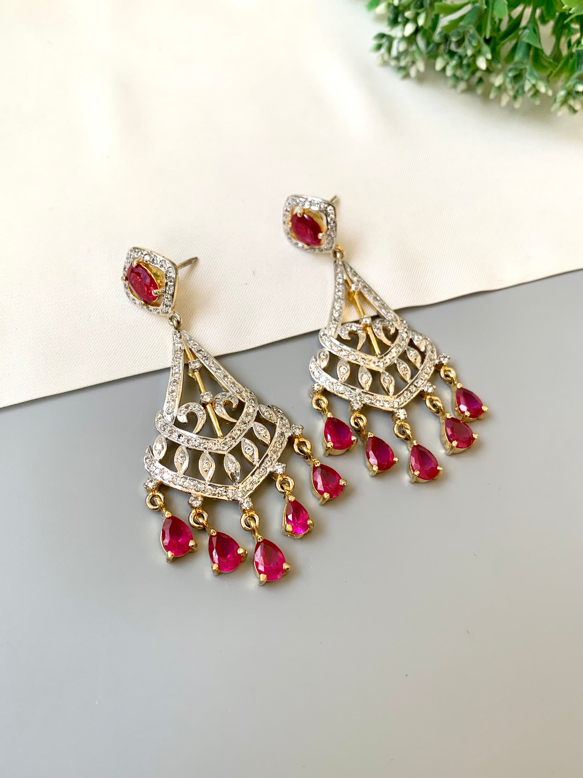 Hand crafted ruby chandelier dangler earrings with 22kt gold plating and American diamonds