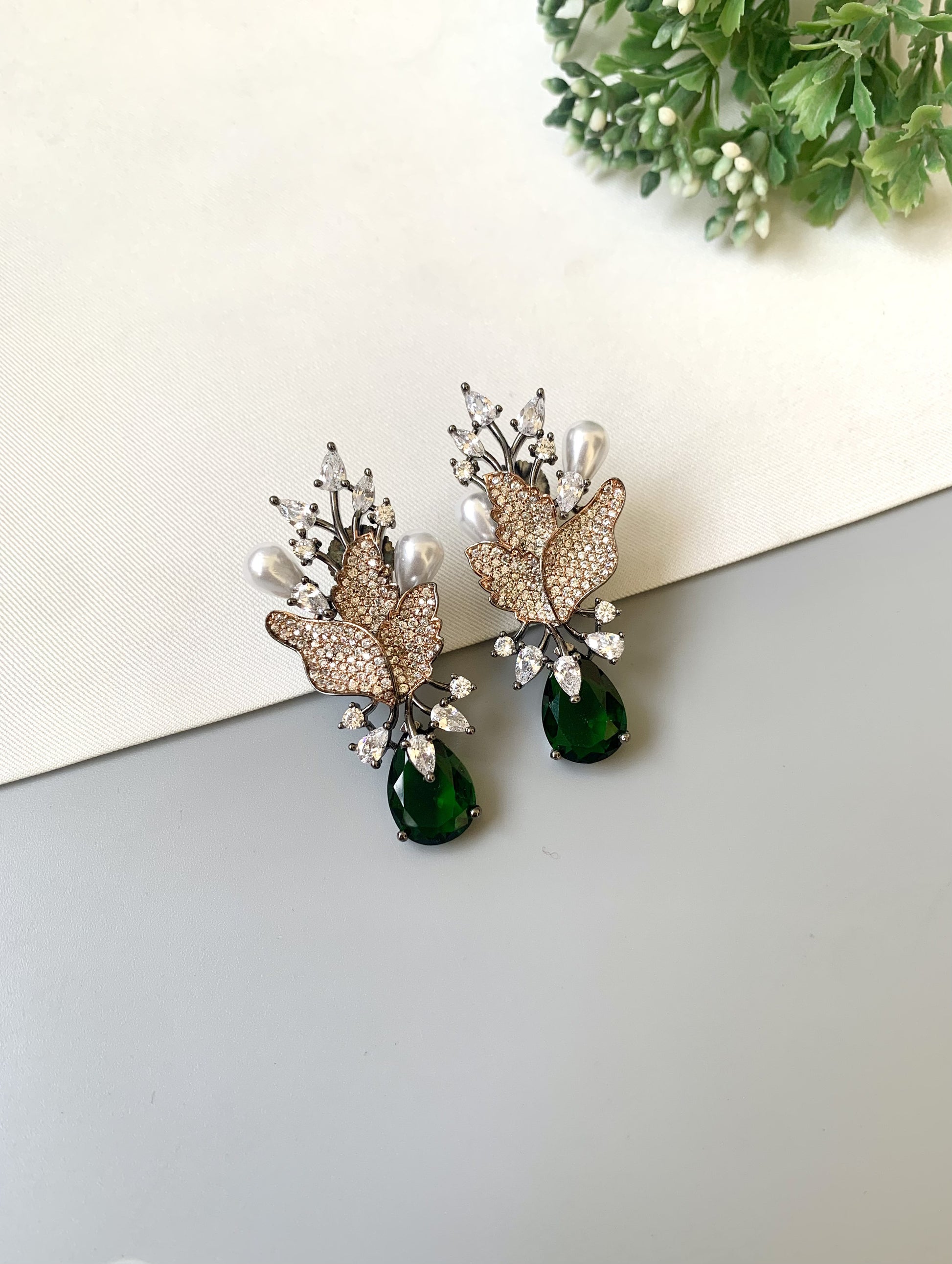 Handcrafted rose gold plated emerald drop earrings with American diamonds and pearl drops by Zamal Jewels