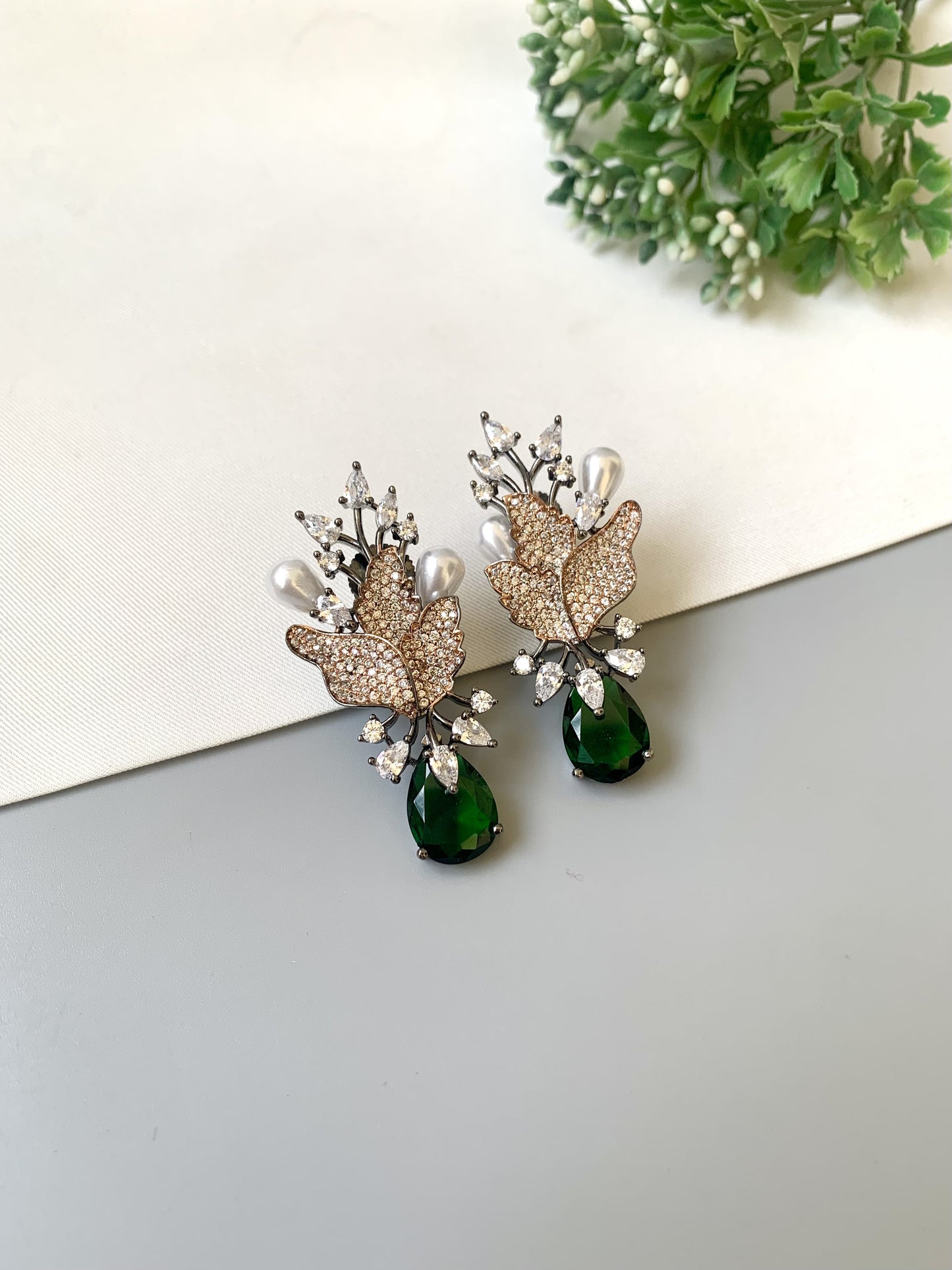Handcrafted rose gold plated emerald drop earrings with American diamonds and pearl drops by Zamal Jewels