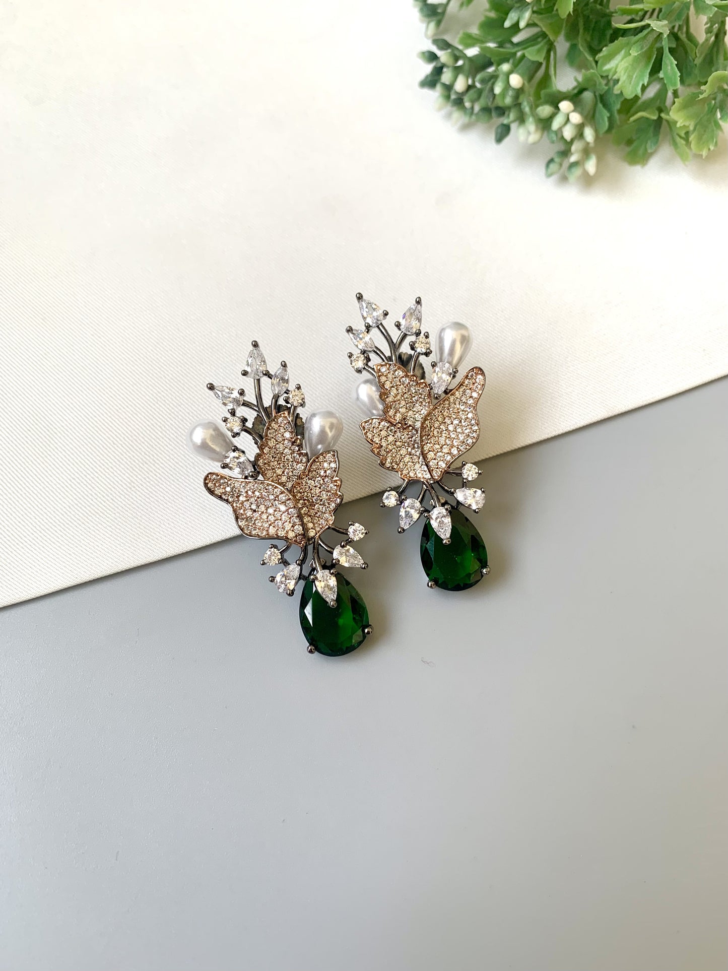 Handcrafted rose gold plated emerald drop earrings with American diamonds and pearl drops by Zamal Jewels