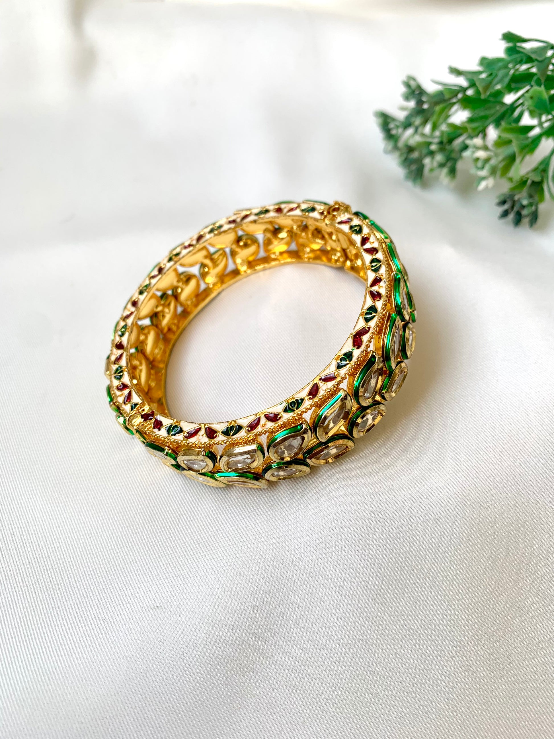 Handcrafted Zareen Bangle in 22kt gold plating with Bikaneri Polki Kundan and hand-painted Meena work — by Zamal Jewels.