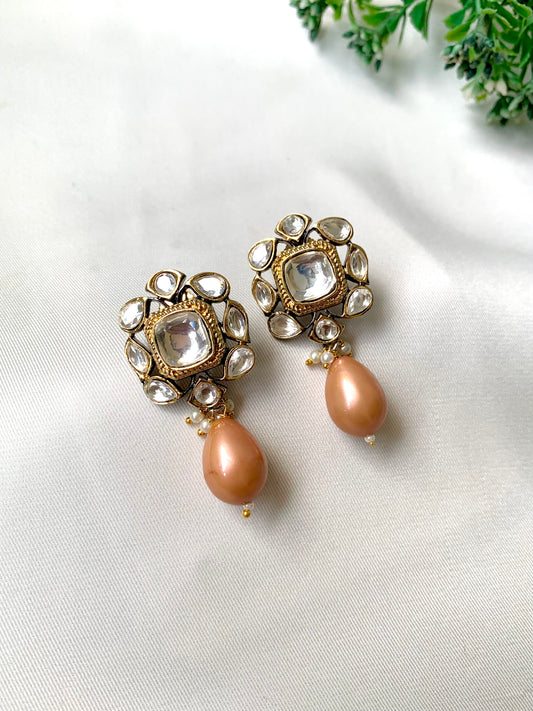 Handcrafted Zareen Earrings in Peach Pearl with Polki Kundan stones and Victorian gold finish by Zamal Jewels