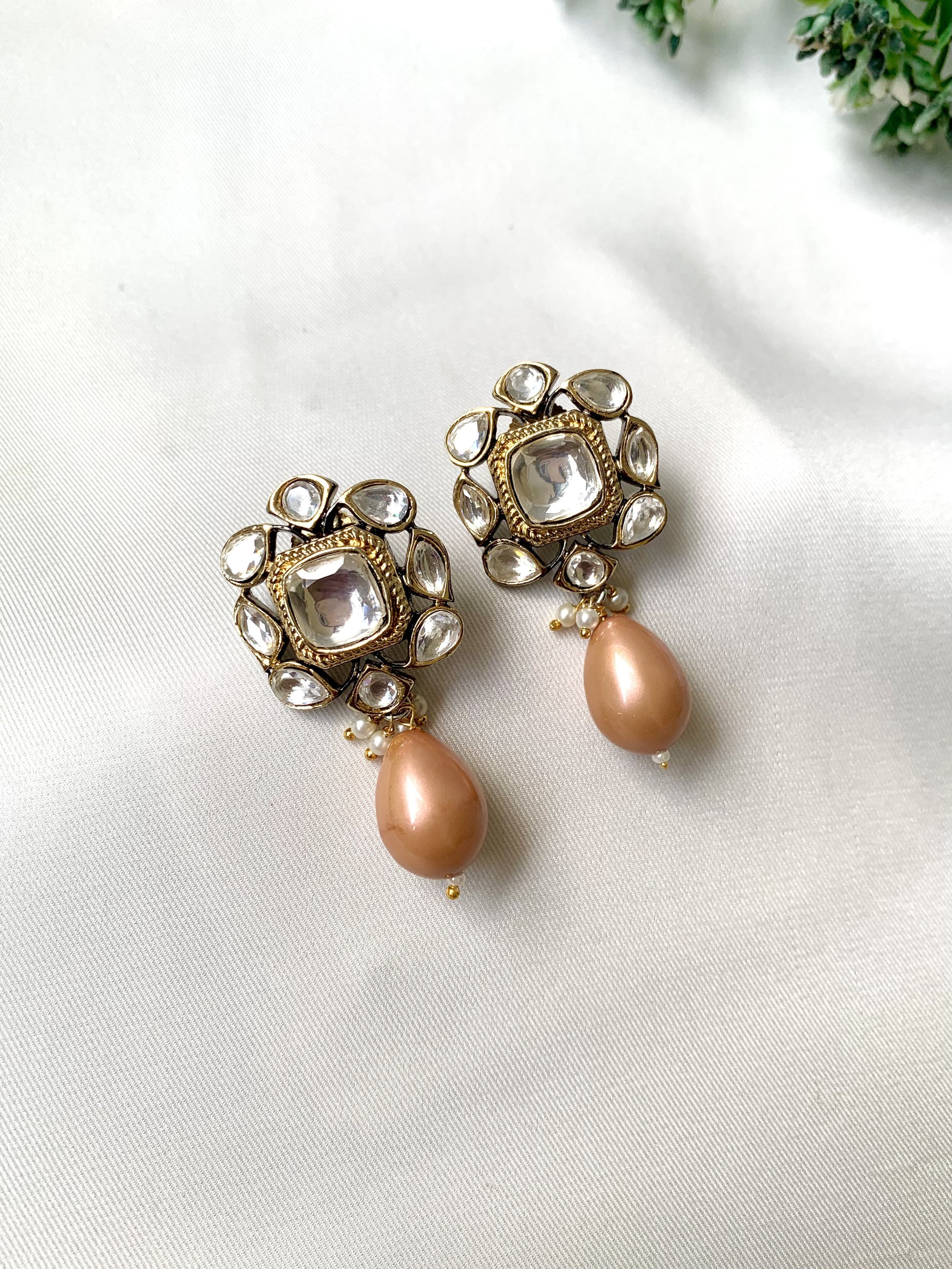 Handcrafted Zareen Earrings in Peach Pearl with Polki Kundan stones and Victorian gold finish by Zamal Jewels