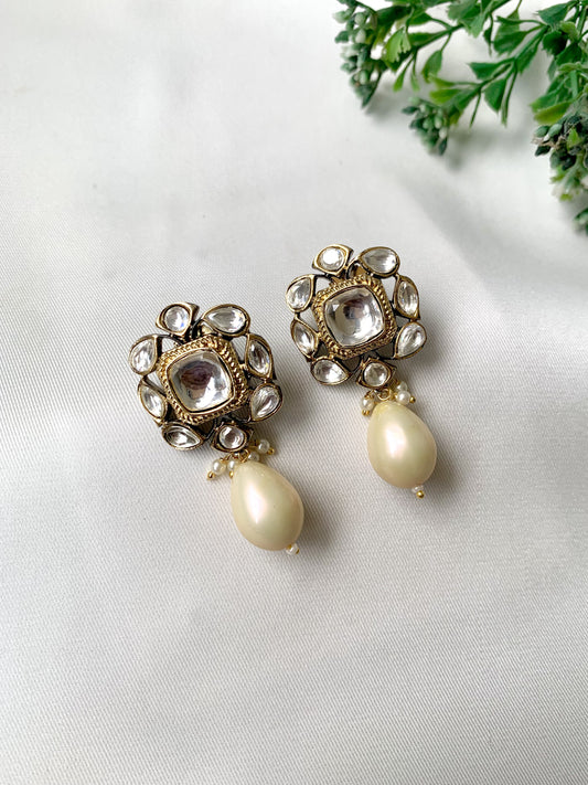 Handcrafted Zareen Earrings in White Pearl with Polki Kundan stones and Victorian gold finish by Zamal Jewels