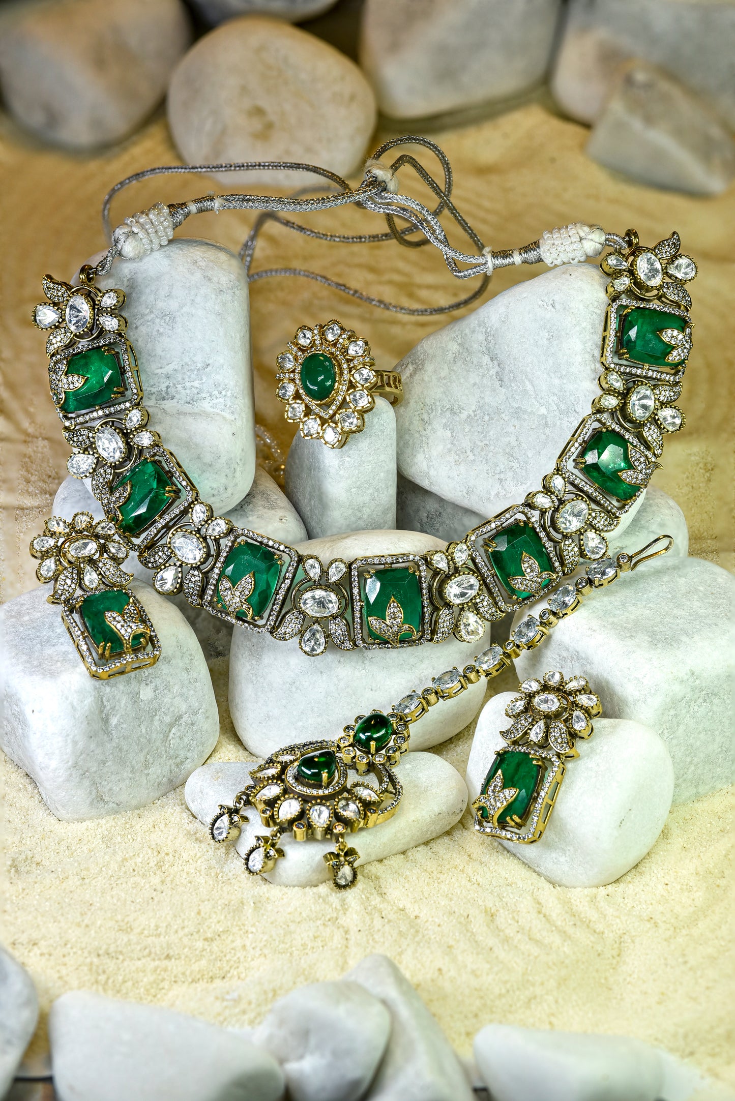 22kt gold and rhodium plated Ganga bridal set with emerald doublet, moissanite kundan and American diamonds from Zareen Collection