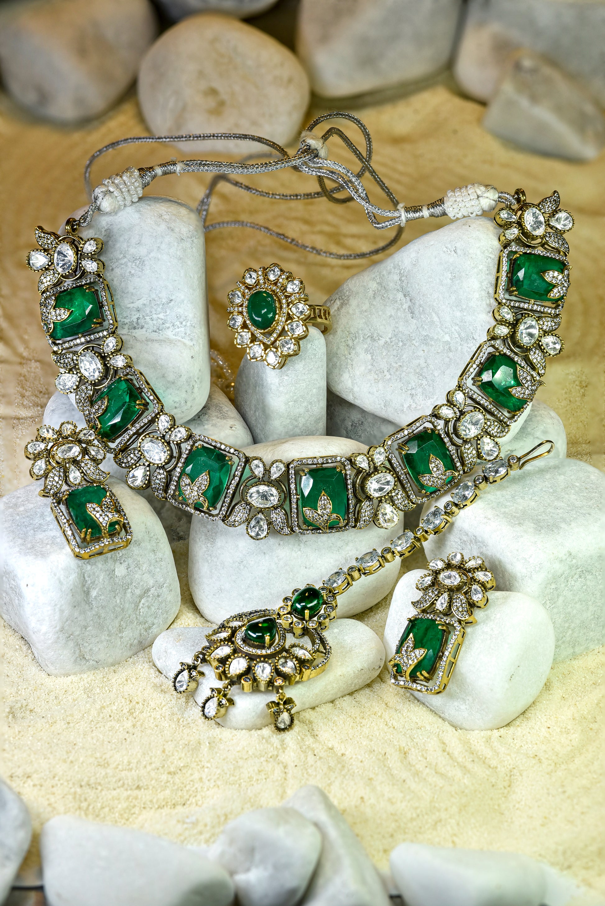 22kt gold and rhodium plated Ganga bridal set with emerald doublet, moissanite kundan and American diamonds from Zareen Collection
