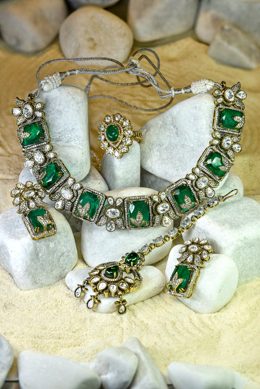 22kt gold and rhodium plated Ganga bridal set with emerald doublet, moissanite kundan and American diamonds from Zareen Collection