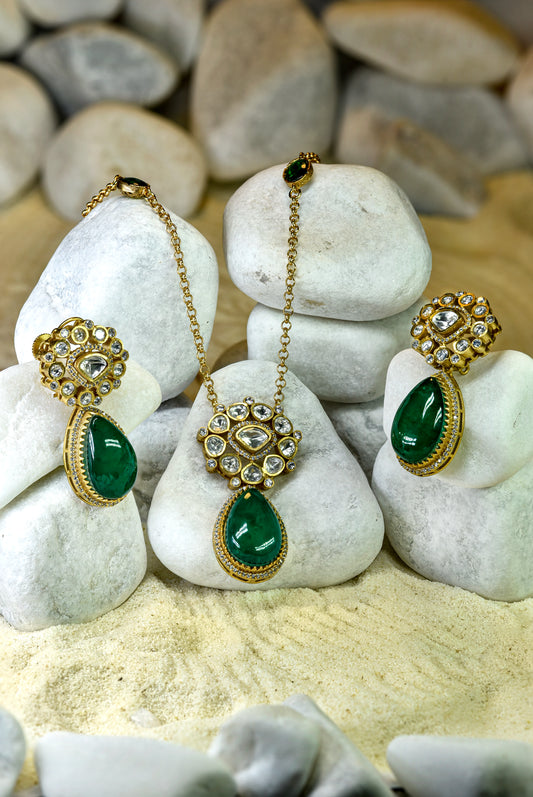 22kt gold Ziva emerald pendant set with moissanite kundan and American Diamonds from Zareen Collection