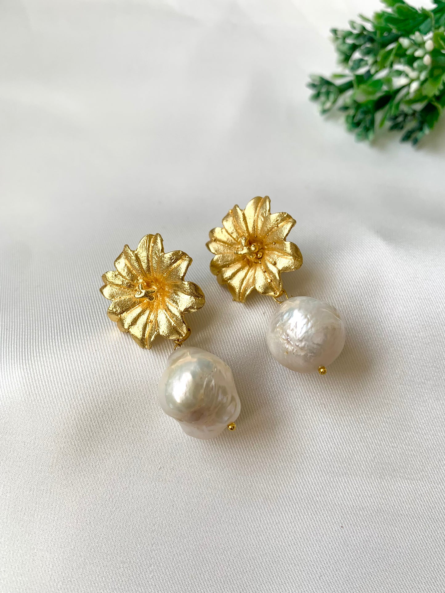 Hand crafted Zarqa studs in 22kt gold plating with foil finish featuring real semi-precious Baroque pearls