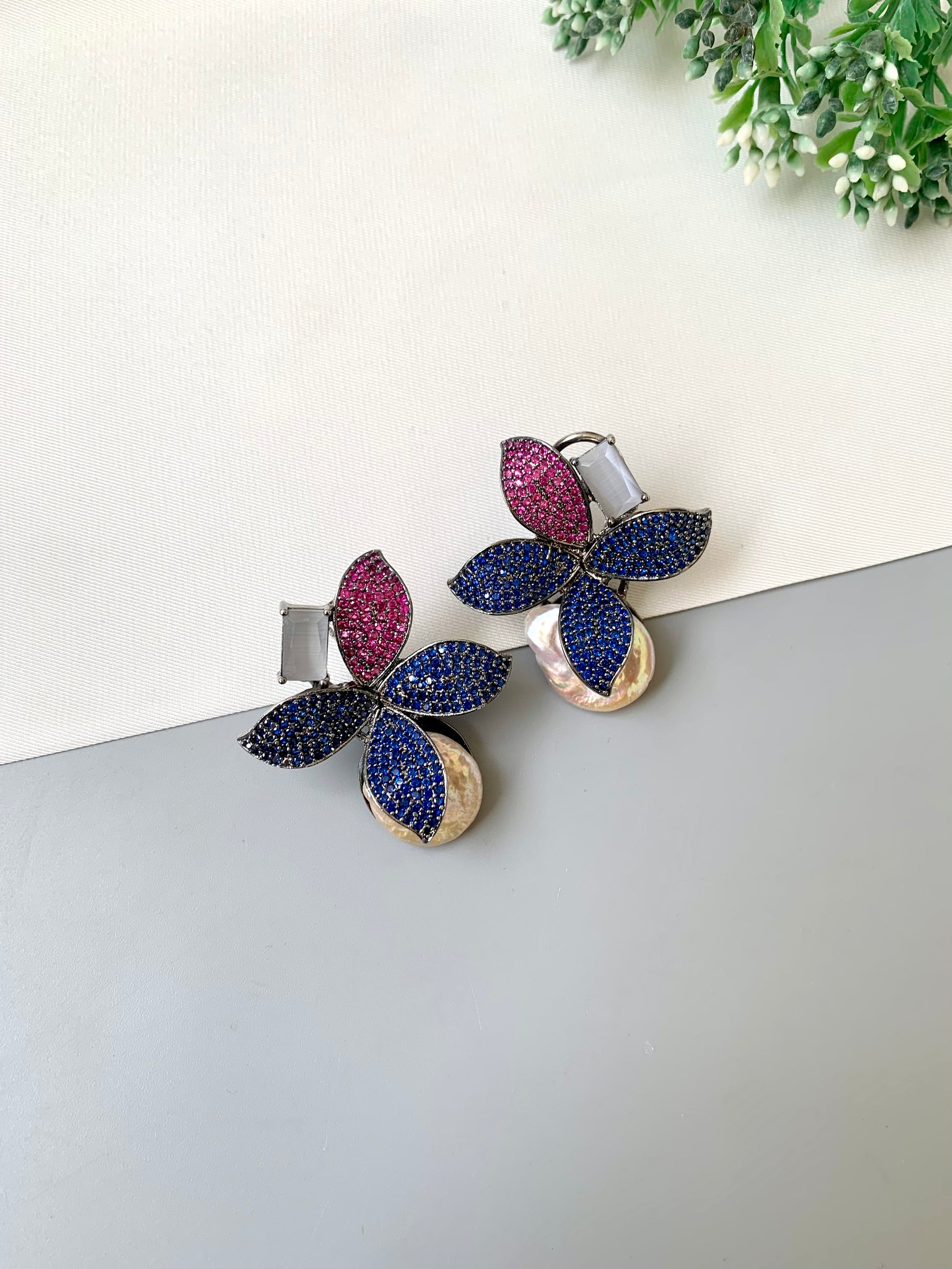 Hand crafted Zarqa designer earrings in rhodium plating featuring real baroque pearls, semi-precious onyx and ruby sapphire Swarovski gemstones