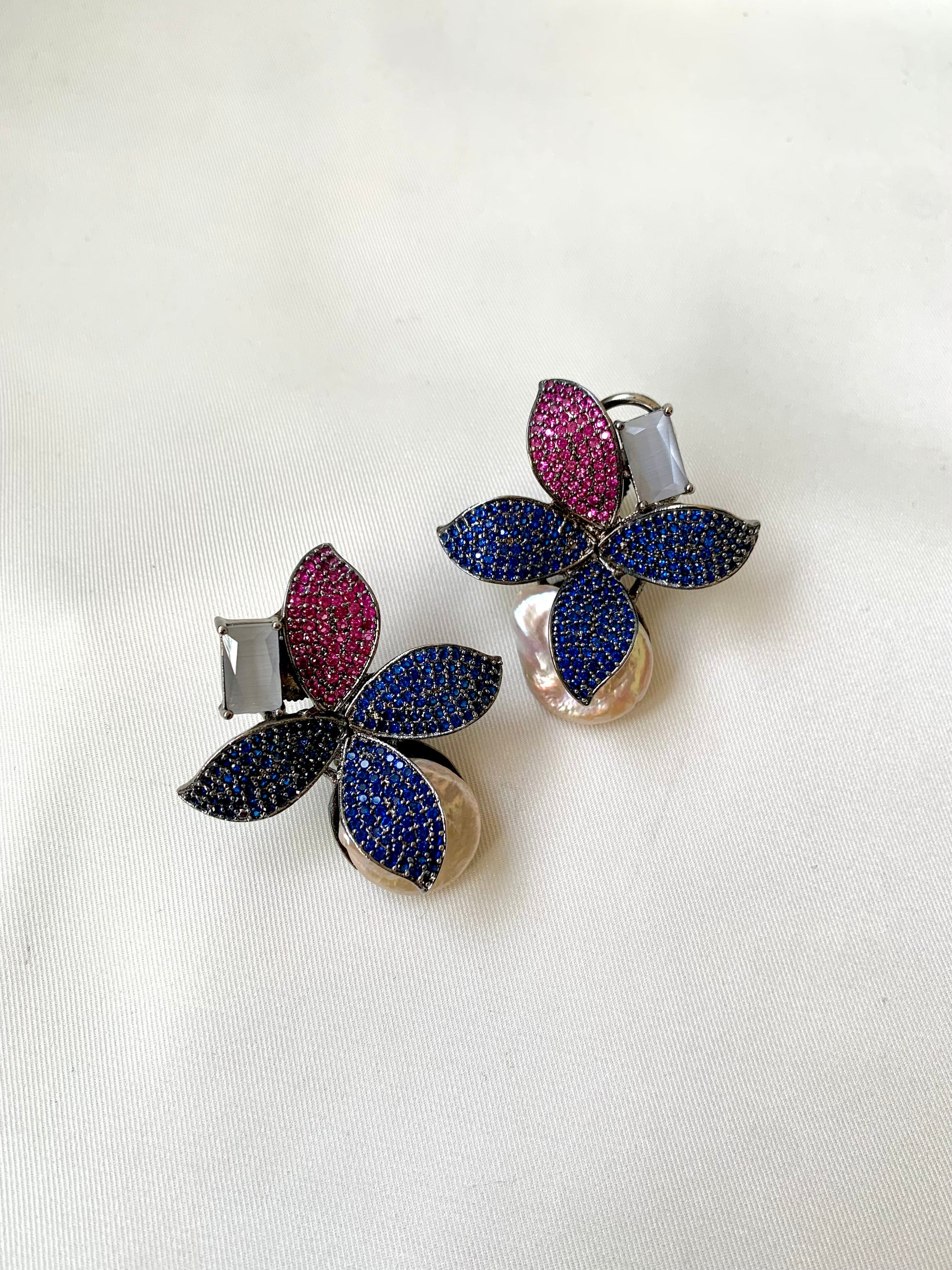 Hand crafted Zarqa designer earrings in rhodium plating featuring real baroque pearls, semi-precious onyx and ruby sapphire Swarovski gemstones