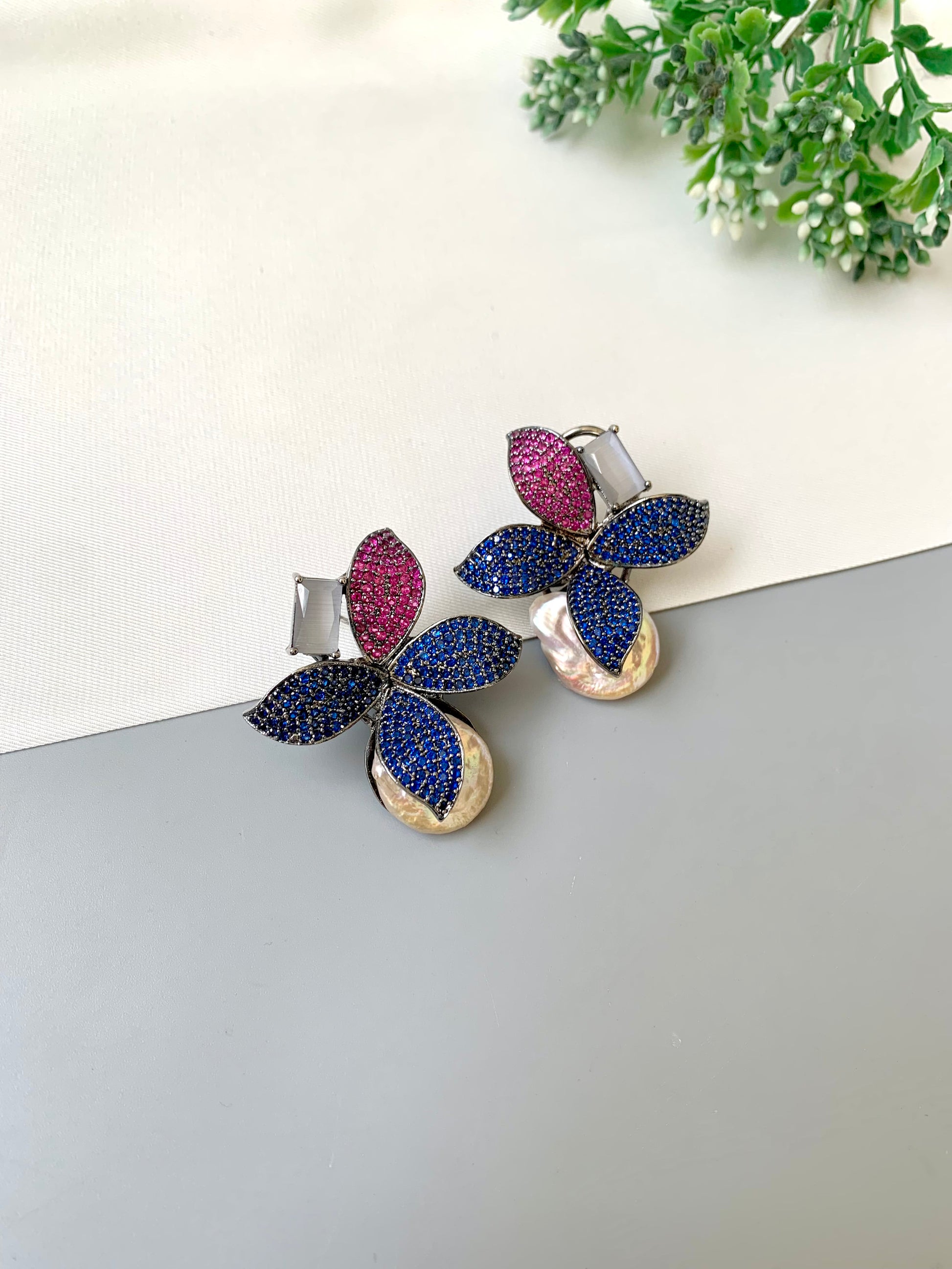 Hand crafted Zarqa designer earrings in rhodium plating featuring real baroque pearls, semi-precious onyx and ruby sapphire Swarovski gemstones