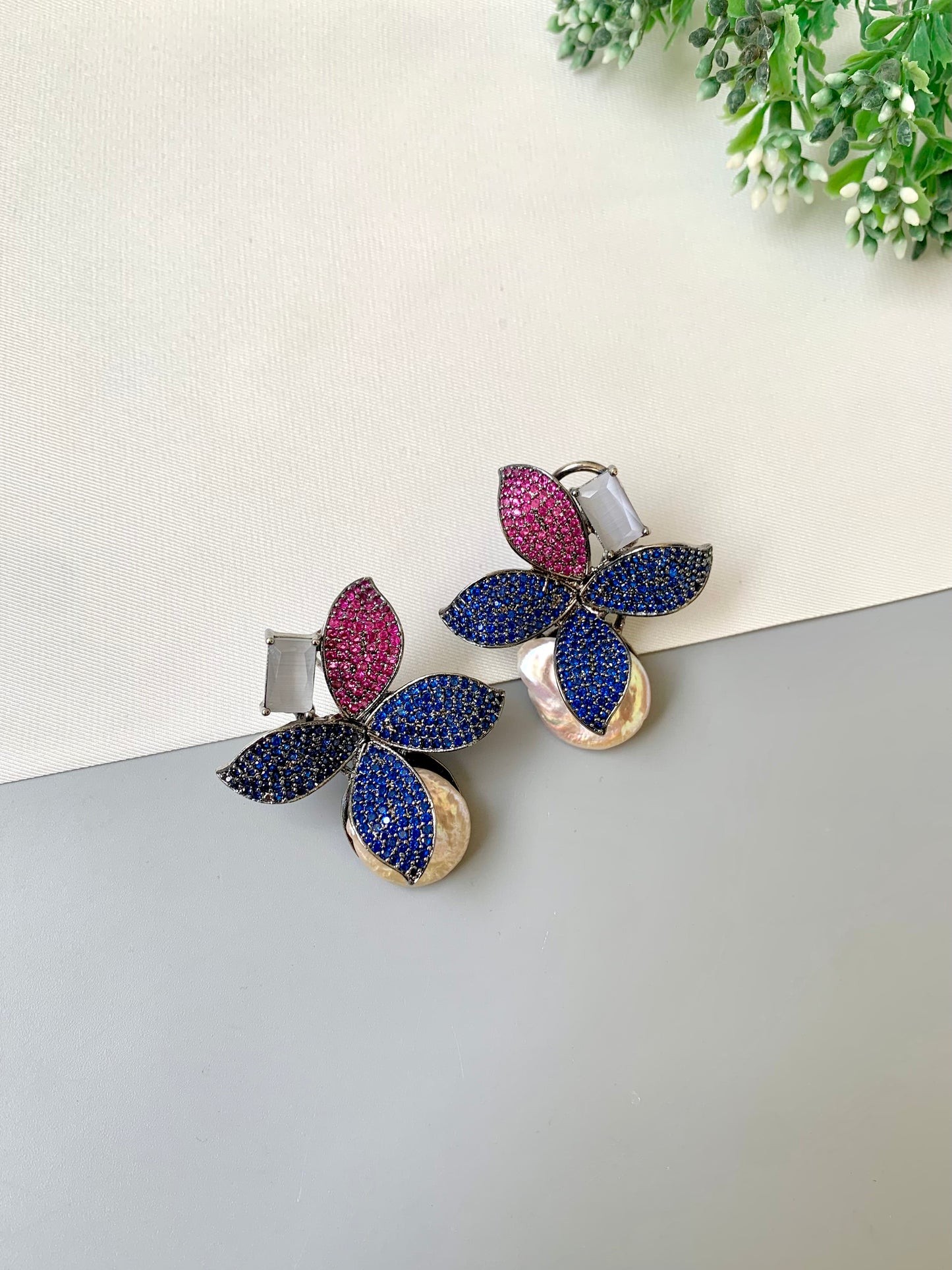 Hand crafted Zarqa designer earrings in rhodium plating featuring real baroque pearls, semi-precious onyx and ruby sapphire Swarovski gemstones