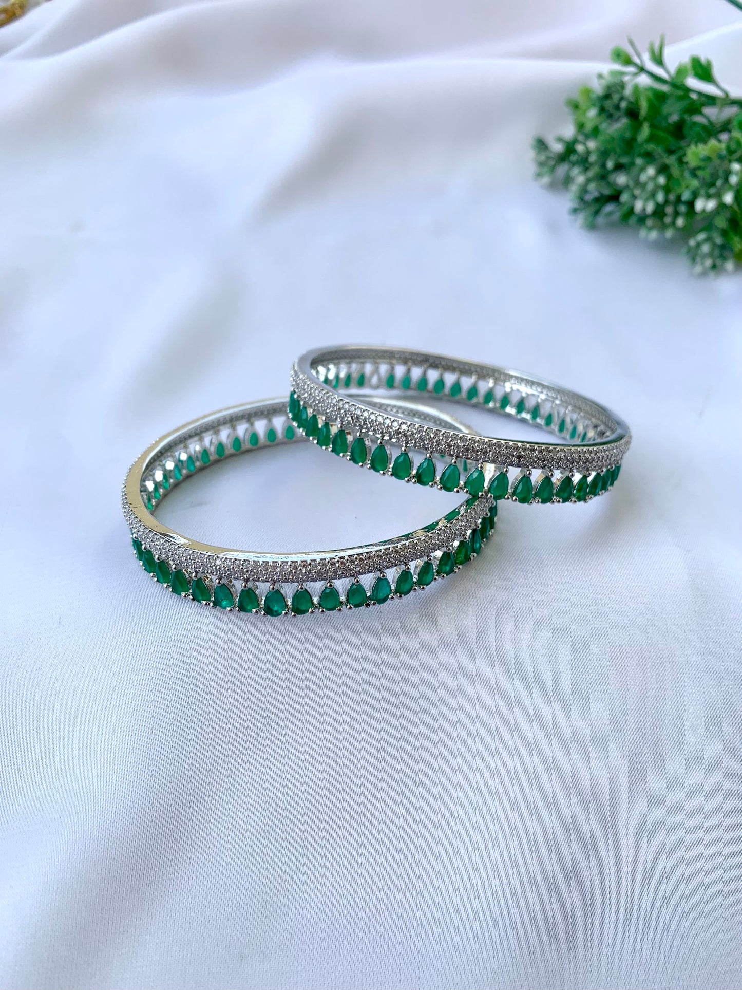 Zerina emerald rhodium plated slide on bangles in platinum finish with American diamonds