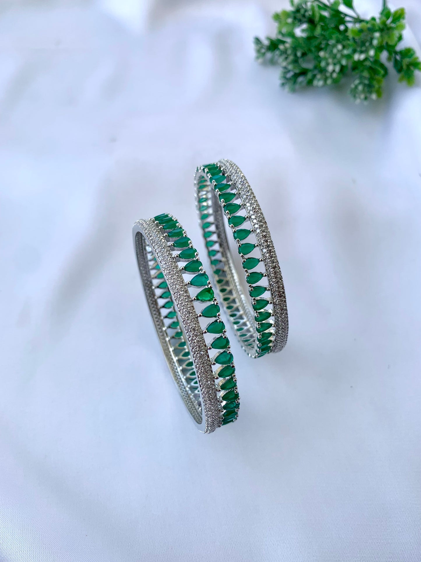 Zerina emerald rhodium plated slide on bangles in platinum finish with American diamonds