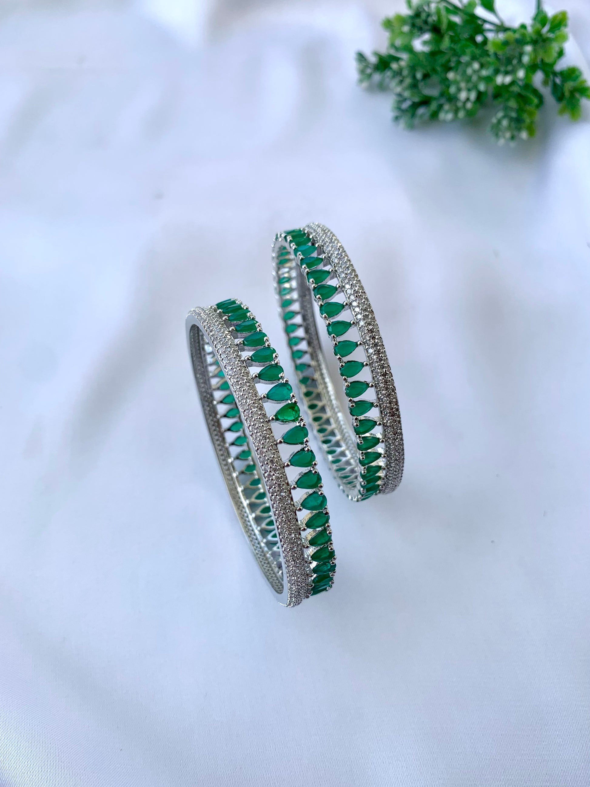 Zerina emerald rhodium plated slide on bangles in platinum finish with American diamonds