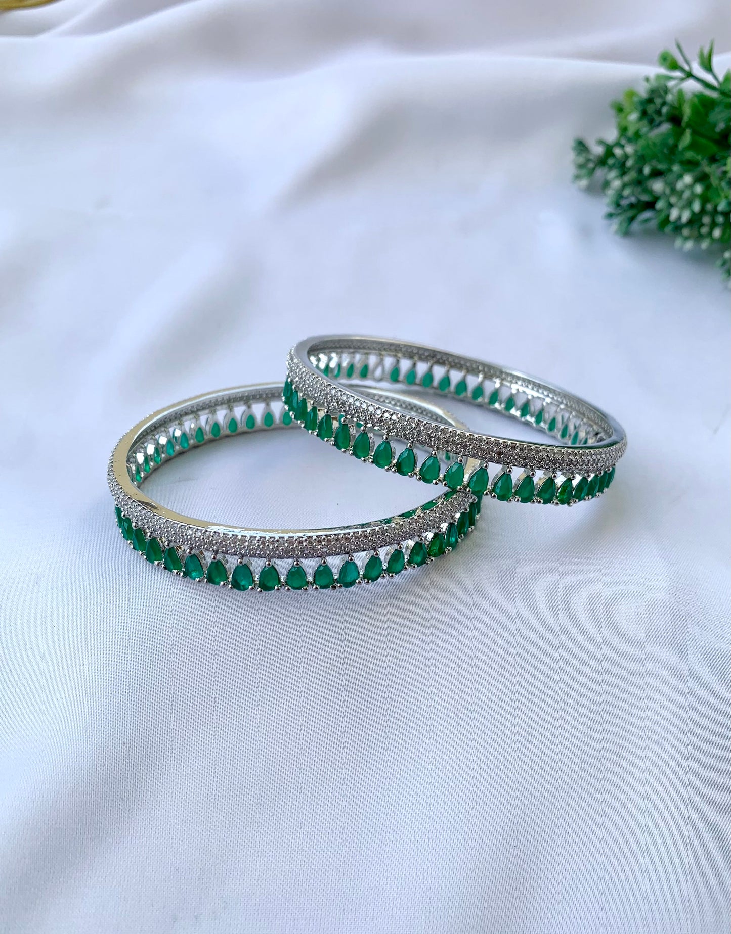 Zerina emerald rhodium plated slide on bangles in platinum finish with American diamonds
