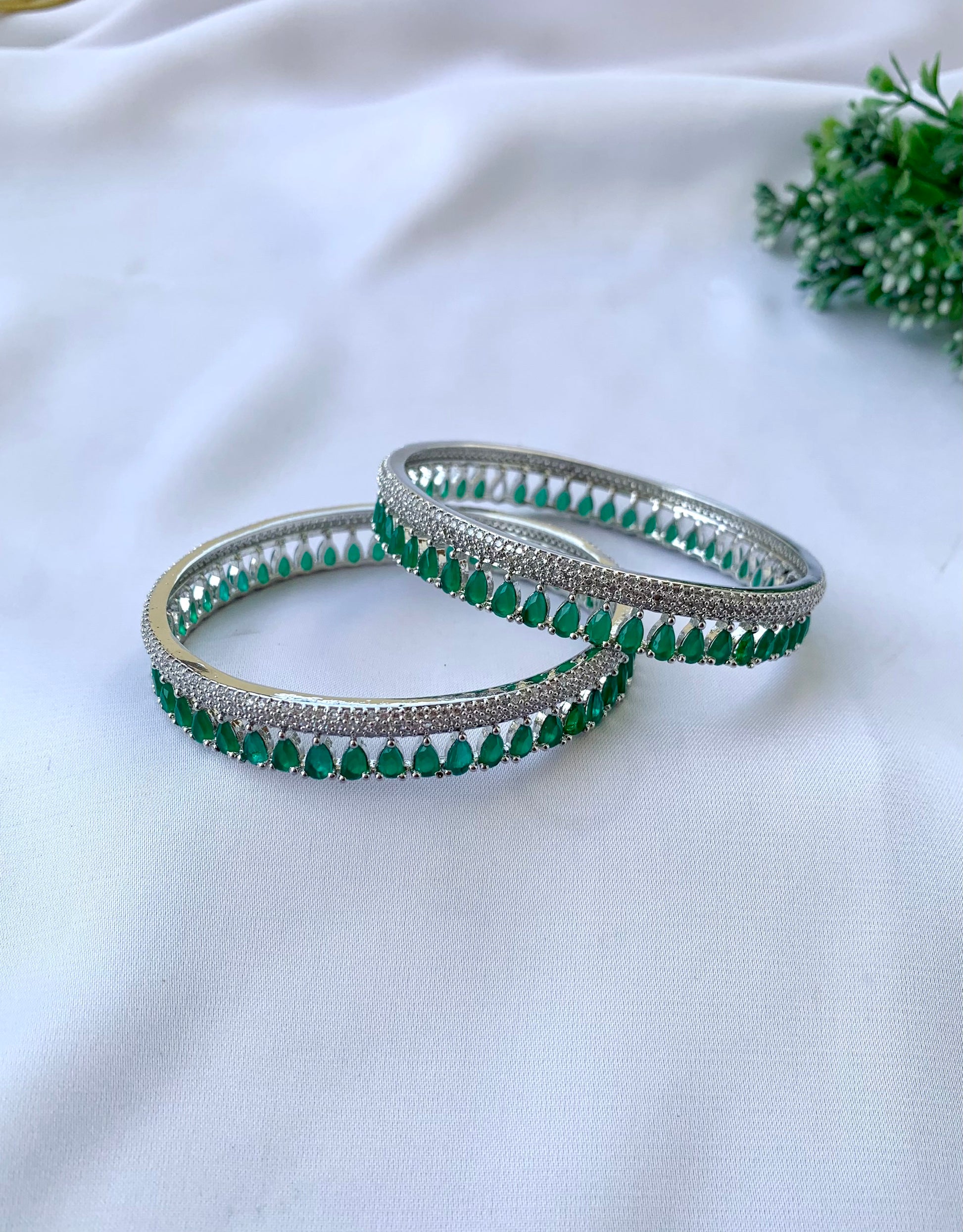 Zerina emerald rhodium plated slide on bangles in platinum finish with American diamonds