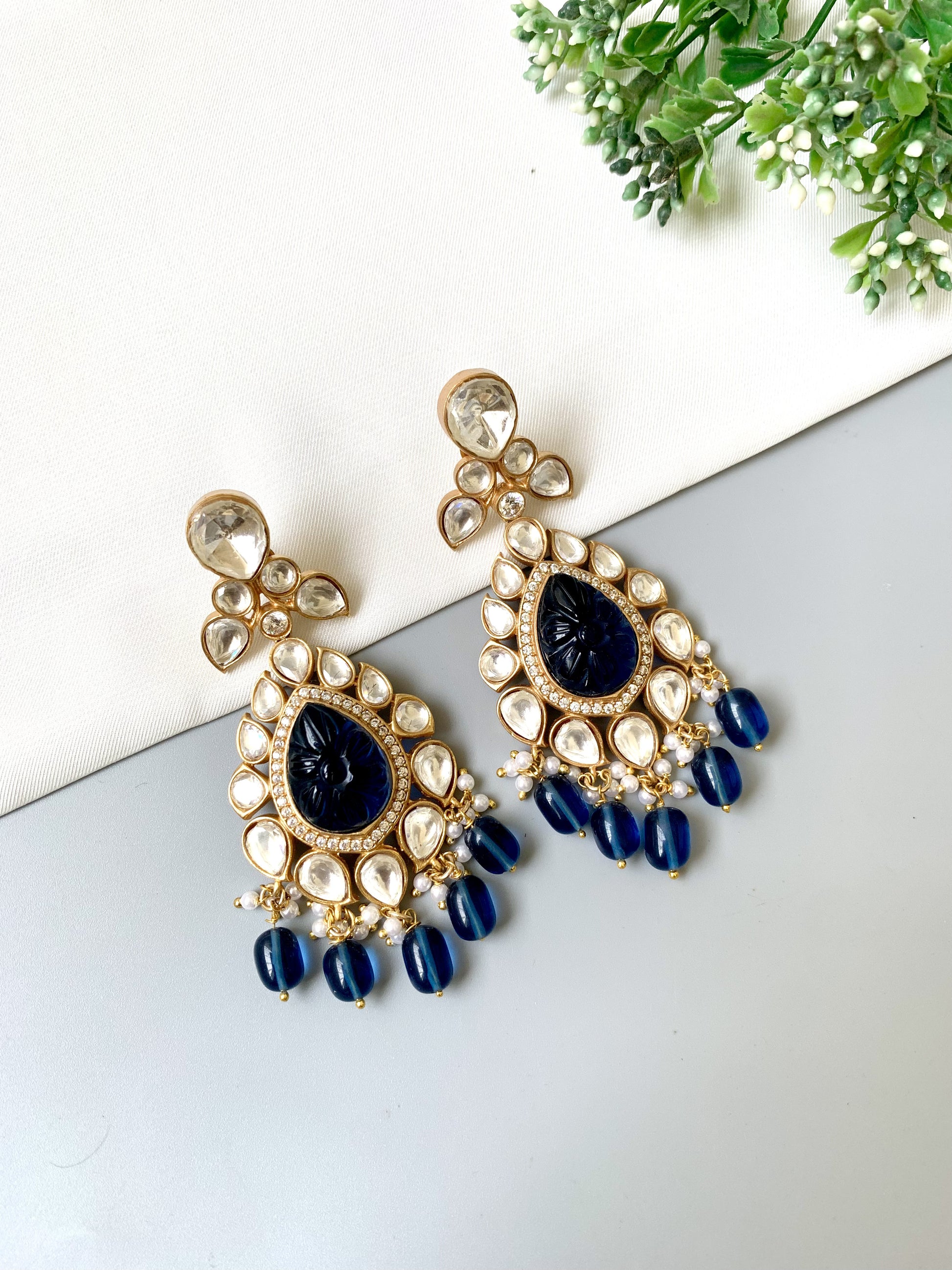 Statement gold plated dangler earrings with hand-carved sapphire, American Diamonds and pearl drops by Zamal Jewels