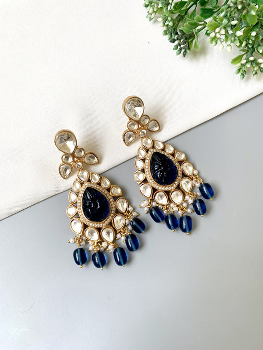 Zoya Signature Danglers with carved sapphire center, surrounded by Moissanite Kundan and American Diamonds in teardrop shape