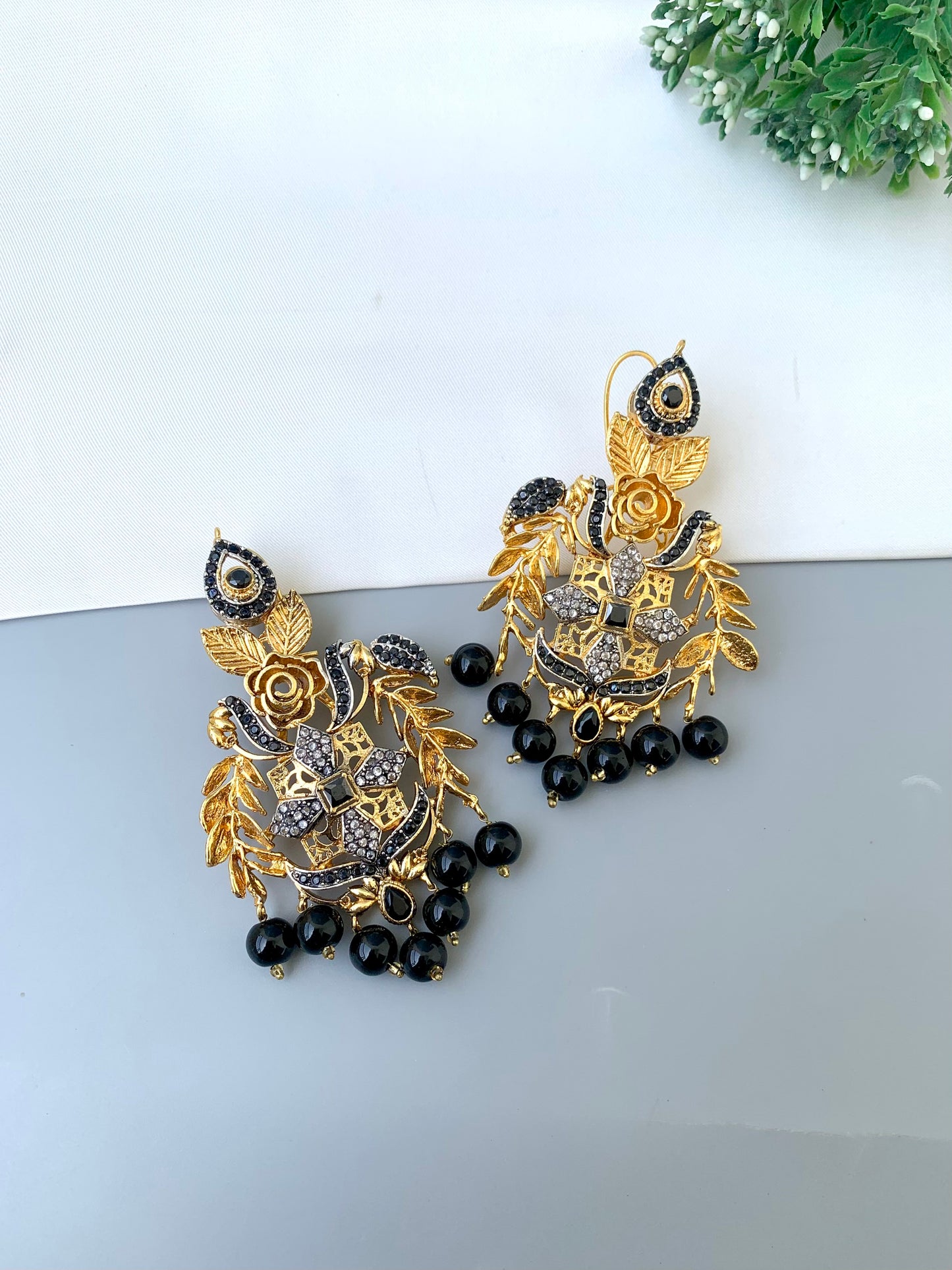 Zulehka black onyx earrings in gold plating with American diamonds