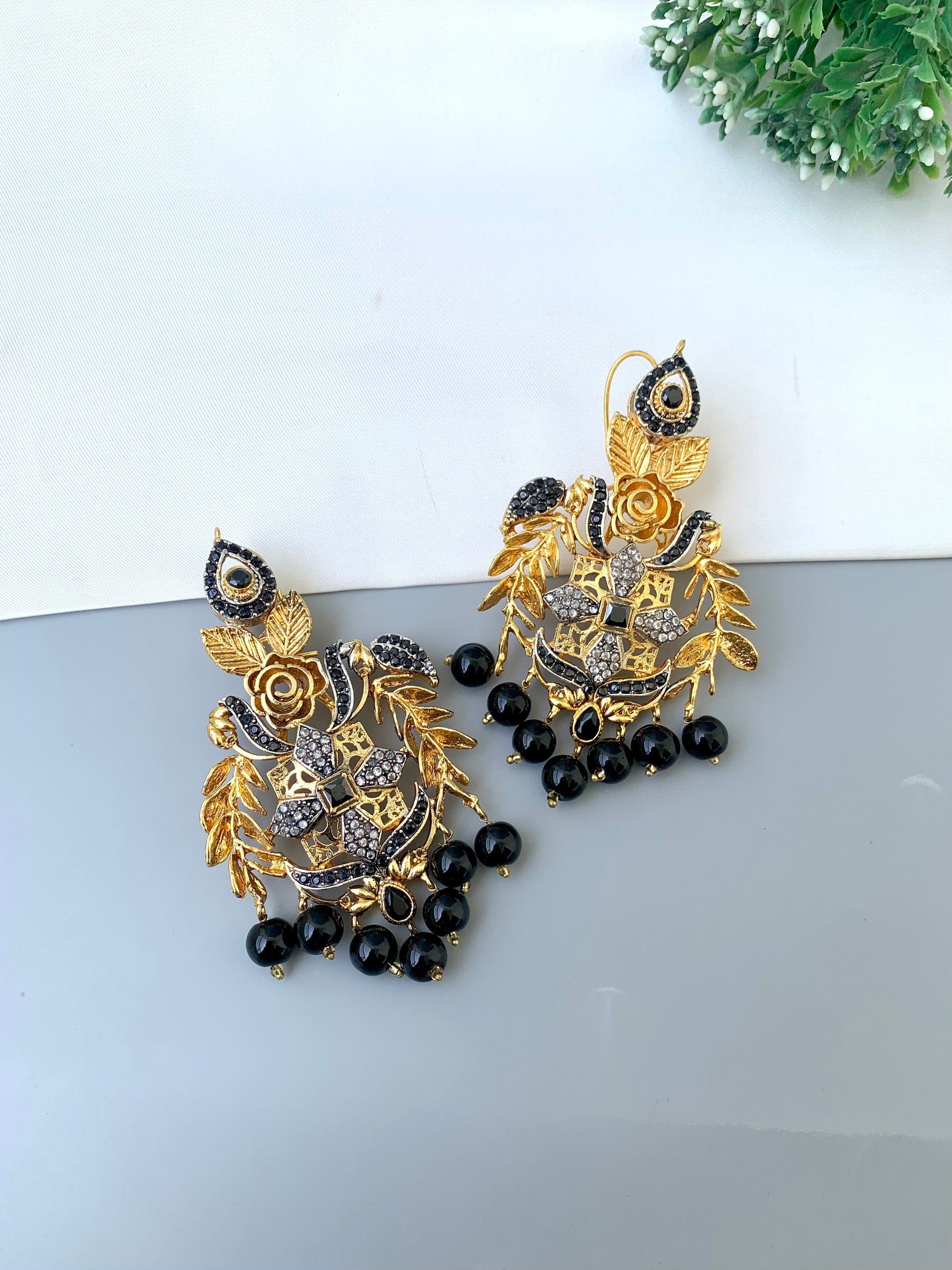 Zulehka black onyx earrings in gold plating with American diamonds
