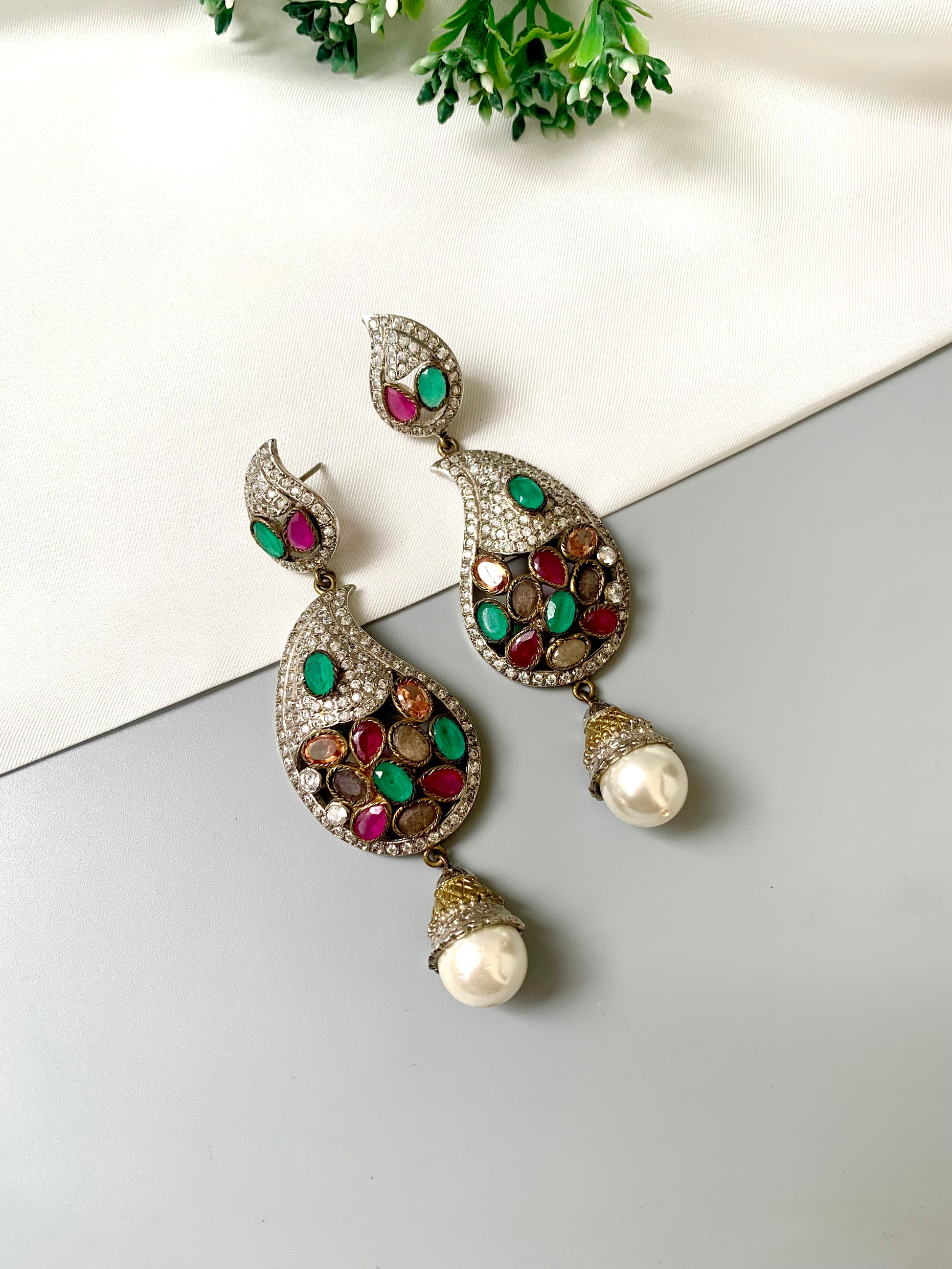 Zuleikha Gemstone Chandelier Earrings in rhodium plating with American Diamonds, Rubies, Emeralds, Sapphires, Champagne stones, and pearl drops