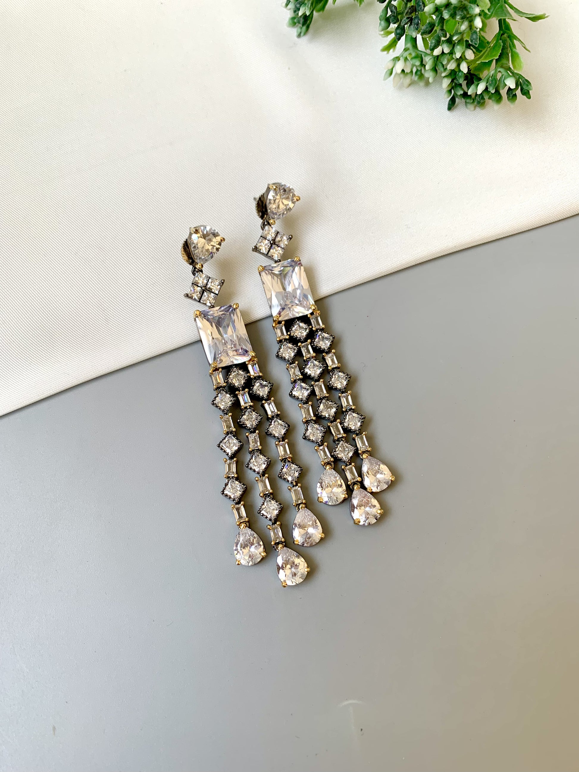 Zunair handcrafted signature earrings in gold and rhodium plating with black oxidized finish and American diamonds